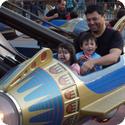 Everest and his dad ride in Disneyland's Astro Orbiter