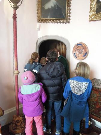 The kids cluster around our guide on a tour of Glamis Castle